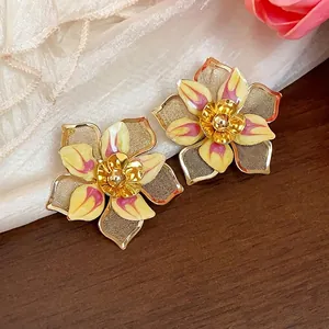 Elegant vintage enamel flower stud earrings with intricate mesh petals and gold finish