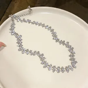 Elegant crystal flower choker necklace detail with silver finish adjustable chain.