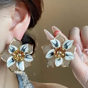 Oversized vintage gold mesh flower stud earrings with white enamel petals for women