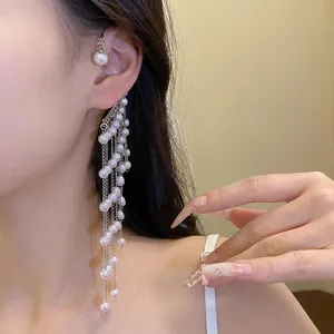 Elegant pearl tassel ear cuff with long silver chains for a sophisticated vintage look