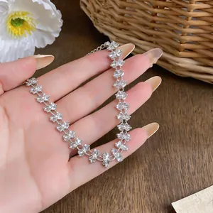 Detailed close-up showing the intricate crystal flower pattern of this silver necklace