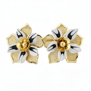 Vintage oversized gold mesh flower stud earrings with black and white enamel petals