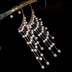 Elegant vintage-style gold pearl tassel ear cuff earring with multiple long dangling chains