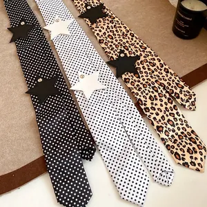 Leopard and polka dot patterned skinny scarves with leather star rivets