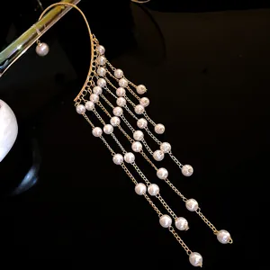 Elegant gold plated pearl tassel ear cuff featuring multiple delicate dangling chains