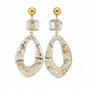 Unique resin teardrop dangle earrings with gold foil flakes and elegant geometric design.