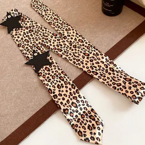 Trendy leopard print skinny scarf with black star patches for versatile styling