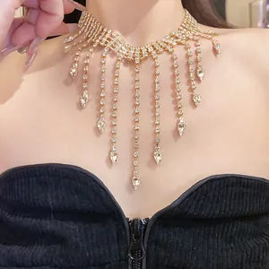 Detailed view of luxury gold-tone rhinestone fringe necklace with teardrop pendants