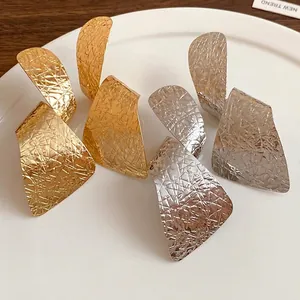 Irregular geometric textured earrings in gold and silver finishes
