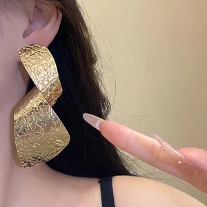 Statement irregular long gold drop earrings with textured finish for fashion women