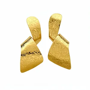 Elegant irregular gold statement earrings with artistic cross-hatched texture for women