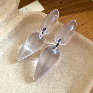 Transparent resin water-drop earrings with a unique segmented minimalist design