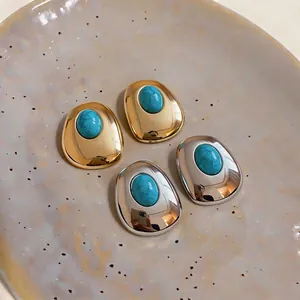 Elegant palace style oval stud earrings with turquoise resin stones in gold and silver
