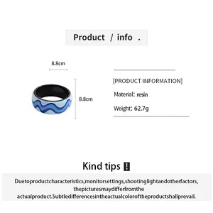 Product specifications for blue resin wave bangle featuring 8.8cm size and weight