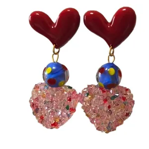 Sweet heart drop earrings with red resin, blue polka beads and pink crystals on white