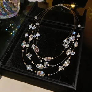 Detailed view of bohemian multi-layer necklace with transparent crystal beads