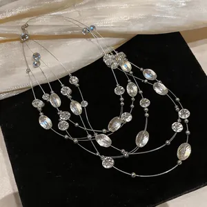 Close-up of bohemian multi-layered crystal beaded necklace with delicate silver wires