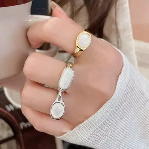 Exquisite detail of 18k gold plated minimalist resin rings on a hand for daily wear