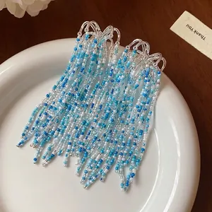 Elegant fireworks style glass bead tassel earrings with silver needles.