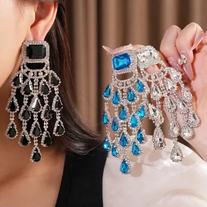 Oversized silver needle rhinestone chandelier earrings featuring blue and black waterdrop tassels