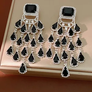 Luxurious silver needle chandelier earrings with black teardrop tassels and rhinestones