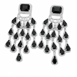 Exquisite silver-tone tassel earrings featuring black teardrop stones and sparkling crystals.