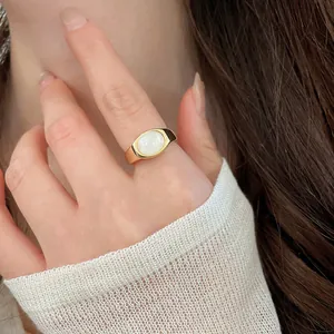 Detailed view of minimalist 18k gold plated open ring featuring a white resin stone