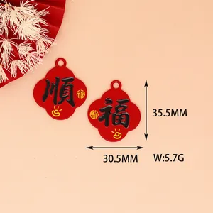 Detailed view of red alloy charm pendants with Chinese characters and size specifications