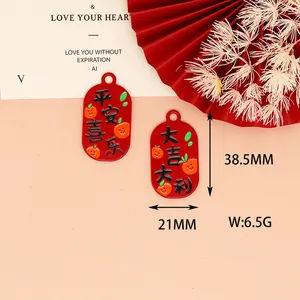 Detailed view of red alloy Chinese blessing charms with 38.5mm x 21mm dimension markers