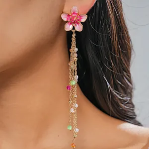 Exquisite close-up of pink flower tassel earring with pearls and colorful glass beads