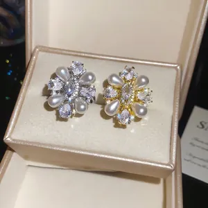Elegant 14k gold plated flower ring featuring sparkling zircon and white pearls