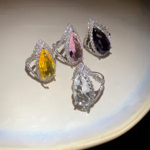 Elegant set of luxury pear-cut zirconia open rings in yellow, pink, purple, and clear