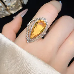 Detailed close-up view of a luxury water drop zircon open ring with elegant halo setting