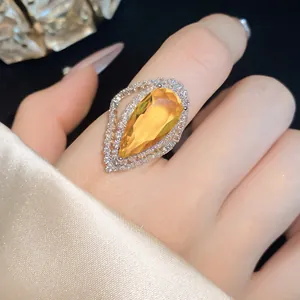 Luxury pear-cut yellow gemstone ring with brilliant zircon halo for elegant ladies