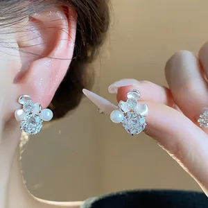 Elegant silver needle zircon flower stud earrings with pearl accents for stylish women