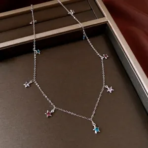Vintage silver-tone necklace with colorful glass star charms and delicate chain