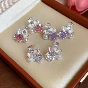 Elegant set of zircon flower pearl stud earrings presented in a luxury gift box, pink purple white