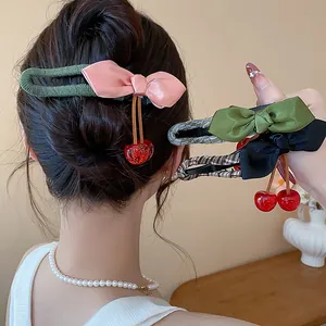 Sweet fabric bow hair clips with cute resin cherry pendants shown in various colors