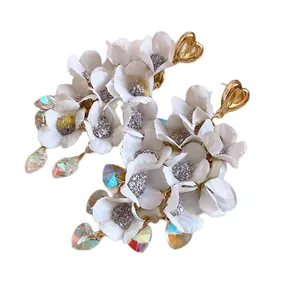 Elegant white cloth flower tassel earrings with iridescent heart-shaped crystal drops