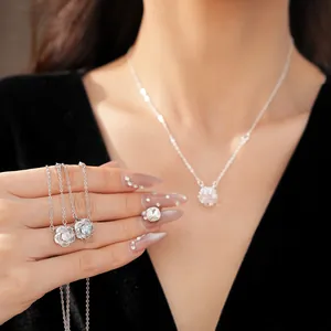 Detailed close-up of a rotating flower necklace with sparkling zircon accents.