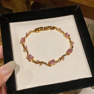 Elegant French vintage gold twisted bracelet featuring pink zircon stones in jewelry box