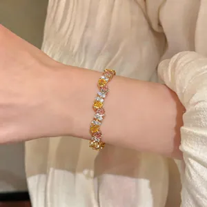 Detailed close-up showing a French retro twisted bracelet with colorful zircons on a wrist