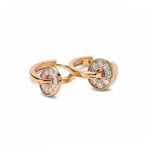 Elegant rose gold hoop earrings featuring pavé-set crystal dangling circular disks.