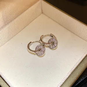 Macro view of exquisite silver double hoop earrings encrusted with sparkling crystals