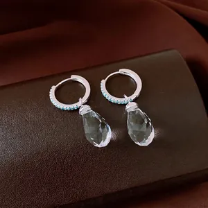 Sparkling zircon crystal teardrop hoop earrings featuring elegant blue stone accents