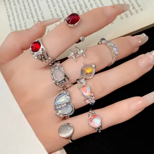 Detailed macro shot of 9-piece rhinestone resin ring set showing various jewelry styles.