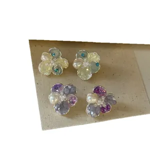 Elegant crystal and pearl flower stud earrings for women with French style aesthetics.