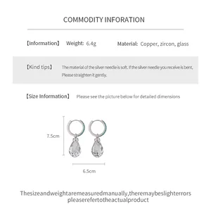 Detailed view of sparkly teardrop zircon earrings with material and weight specifications