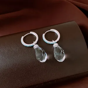 Elegant silver hoop earrings featuring sparkling turquoise zircon and clear water-drop crystals