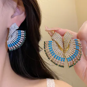 Detailed close-up showing luxury vintage geometric earrings with colorful rhinestones and gems